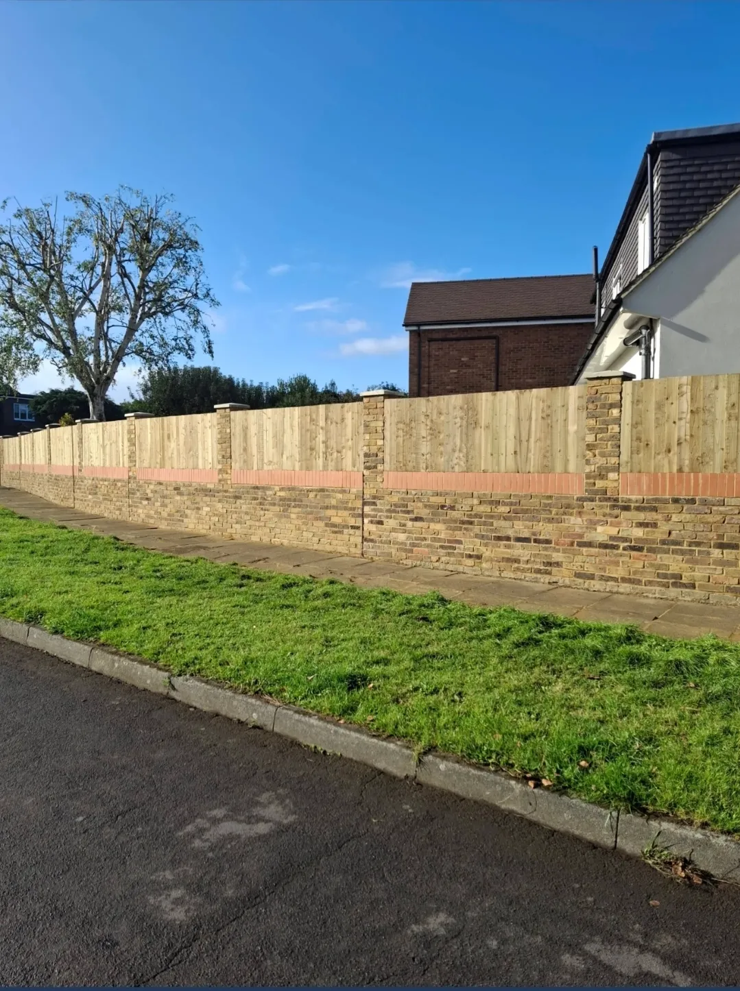 Brick and timber panel boundary wall — builders Surrey