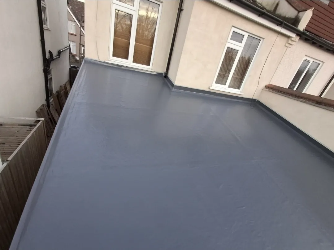 Grey GRP flat roof house completed — flat roof specialists Surrey