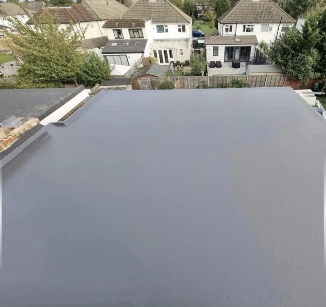 Grey GRP flat roof large aerial suburban view — flat roof contractors Surrey