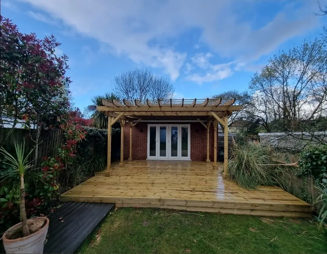 Pergola and timber decking garden extension — landscaping contractors SW London